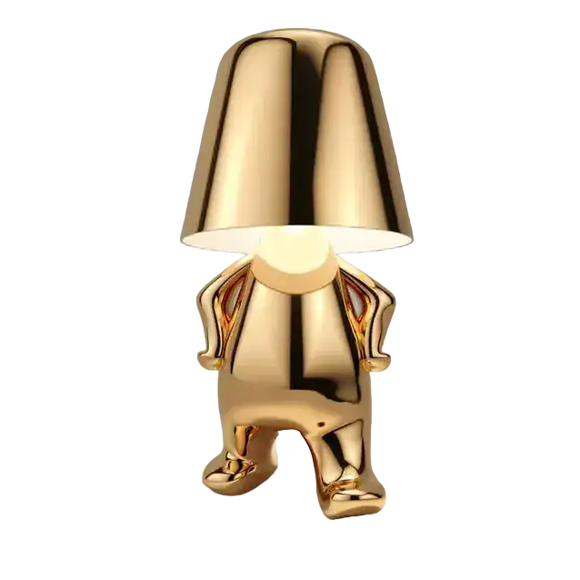 A Little Mr Who Lamp, Golden in Color, Modestly Covers Its Gold Penis, Showing No Shyness